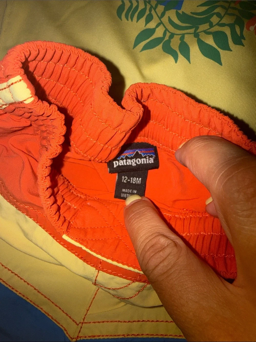 Patagonia Yellow Hoodie with Red, Blue & Yellow Colorblock Swim Shorts
